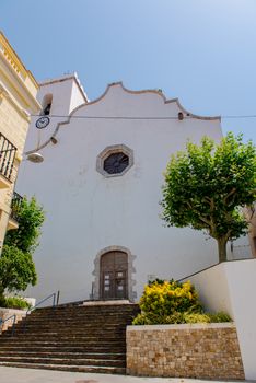 Port de la Selva, Spain : 9 July 2020 : View of The church is dedicated to Santa Maria de les Neus in Port de la Selva, one of the most touristic villages of Costa Brava, on 9 July 2020, in Port de la Selva, Catalonia, Spain.