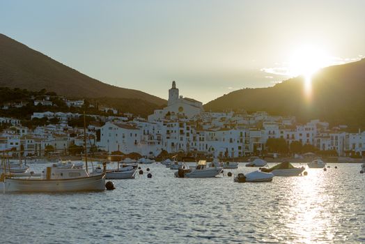 Cadaques, Spain : 07 JULY 2020 : Boats in the beach and houses of the village of Cadaques, Spain in summer on 07 july 2020.