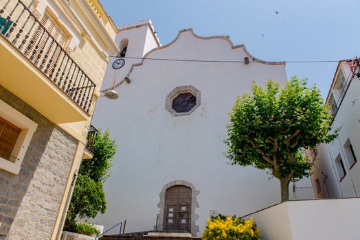 Port de la Selva, Spain : 9 July 2020 : View of The church is dedicated to Santa Maria de les Neus in Port de la Selva, one of the most touristic villages of Costa Brava, on 9 July 2020, in Port de la Selva, Catalonia, Spain.