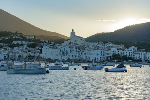 Cadaques, Spain : 07 JULY 2020 : Boats in the beach and houses of the village of Cadaques, Spain in summer on 07 july 2020.