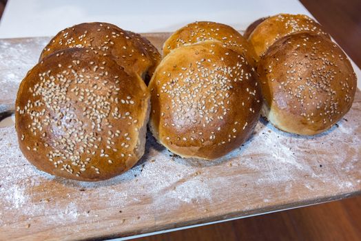 Homemade bread on table with light white flour.