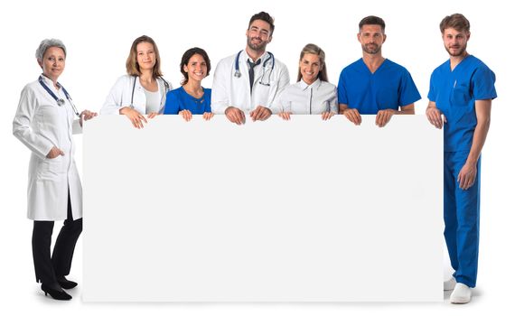 Group of doctors with blank banner isolated over a white background