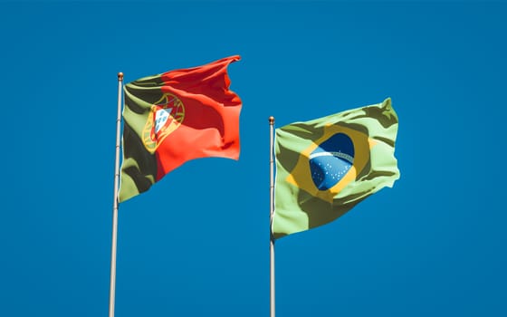 Beautiful national state flags of Portugal and Brasil together at the sky background. 3D artwork concept. 