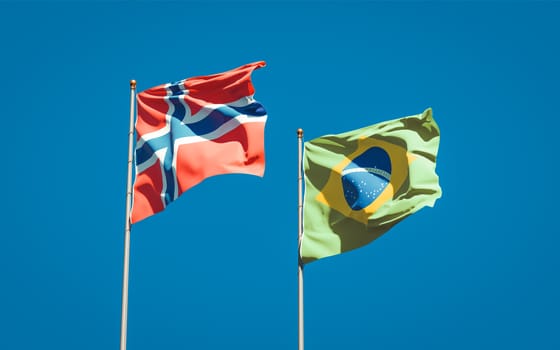 Beautiful national state flags of Norway and Brasil together at the sky background. 3D artwork concept. 