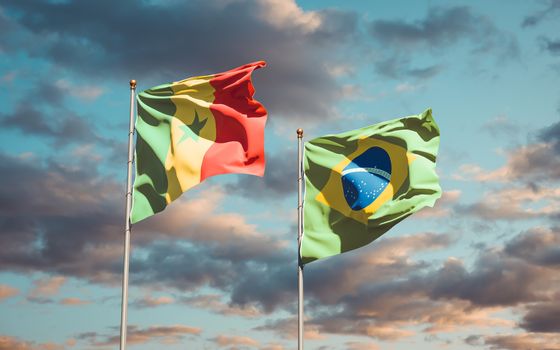 Beautiful national state flags of Senegal and Brasil together at the sky background. 3D artwork concept. 