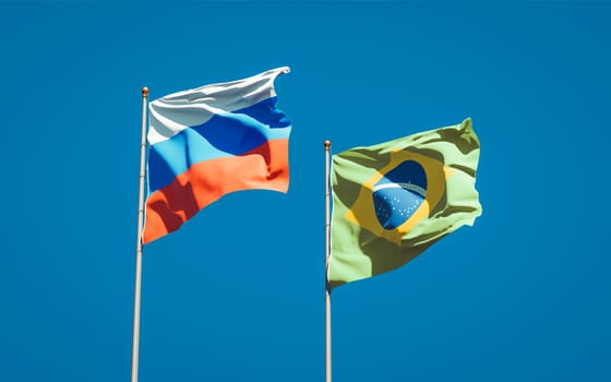 Beautiful national state flags of Russia and Brasil together at the sky background. 3D artwork concept. 