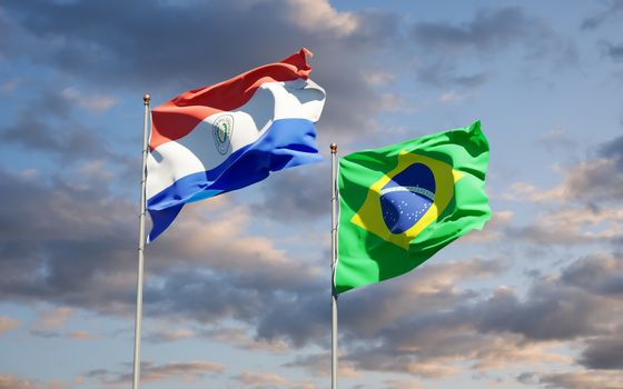 Beautiful national state flags of Paraguay and Brasil together at the sky background. 3D artwork concept. 