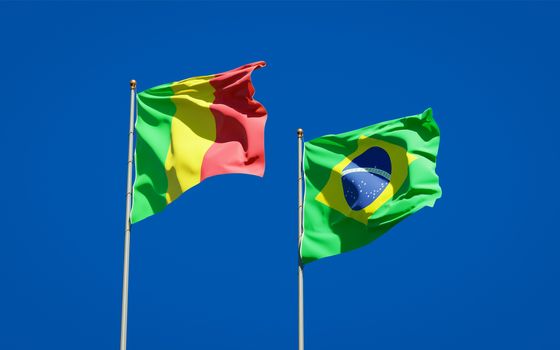 Beautiful national state flags of Mali and Brasil together at the sky background. 3D artwork concept. 