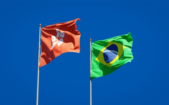 Beautiful national state flags of Hong Kong HK and Brasil together at the sky background. 3D artwork concept. 