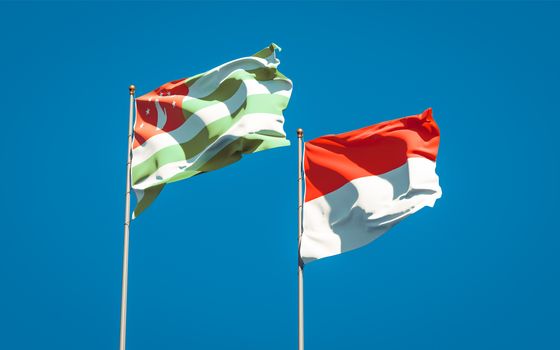 Beautiful national state flags of Indonesia and Abkhazia together at the sky background. 3D artwork concept. 