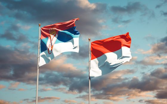 Beautiful national state flags of Serbia and Indonesia together at the sky background. 3D artwork concept. 