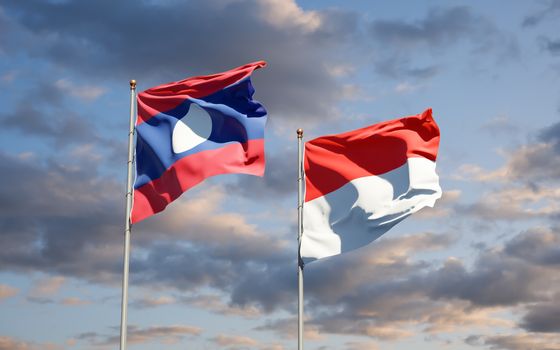 Beautiful national state flags of Laos and Indonesia together at the sky background. 3D artwork concept. 