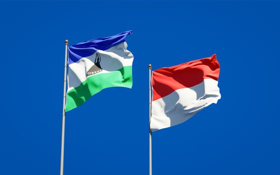 Beautiful national state flags of Lesotho and Indonesia together at the sky background. 3D artwork concept. 
