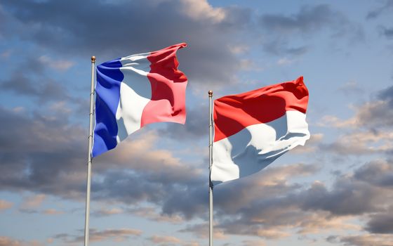 Beautiful national state flags of France and Indonesia together at the sky background. 3D artwork concept. 