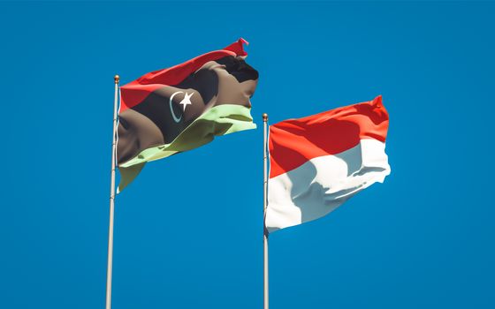 Beautiful national state flags of Libya and Indonesia together at the sky background. 3D artwork concept. 