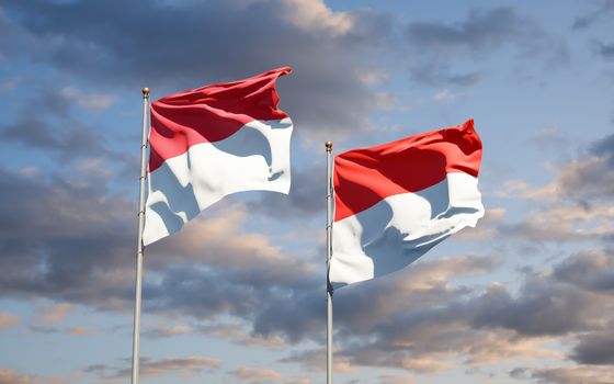 Beautiful national state flags of Monaco and Indonesia together at the sky background. 3D artwork concept. 