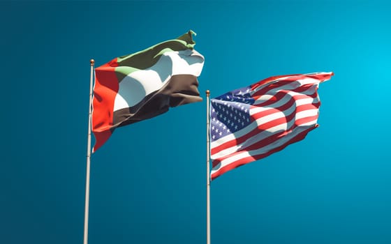 Beautiful national state flags of United Arab Emirates UAE and USA together at the sky background. 3D artwork concept. 