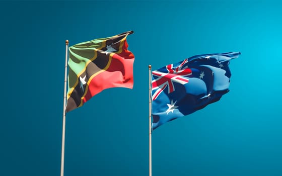 Beautiful national state flags of Saint Kitts and Nevis and Australia together at the sky background. 3D artwork concept. 