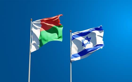 Beautiful national state flags of Madagascar and Israel together at the sky background. 3D artwork concept.