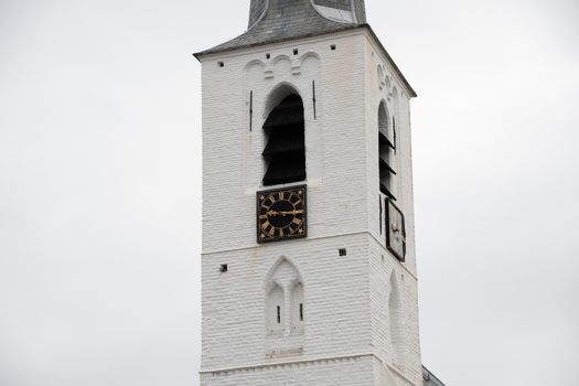 White church in Noordwijkerhout in the Netherlands with cloudy sky