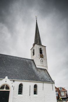 White church in Noordwijkerhout in the Netherlands with cloudy sky