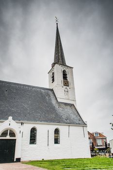 White church in Noordwijkerhout in the Netherlands with cloudy sky