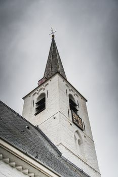 White church in Noordwijkerhout in the Netherlands with cloudy sky