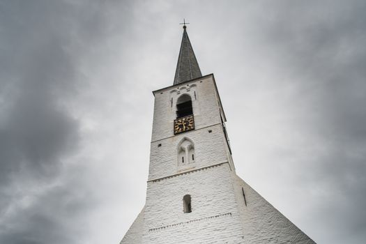 White church in Noordwijkerhout in the Netherlands with cloudy sky