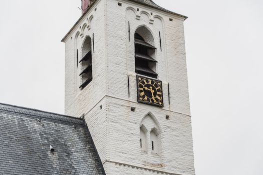 White church in Noordwijkerhout in the Netherlands with cloudy sky