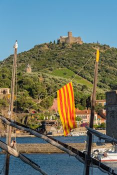 Coliure, France :  2020 june 22 :  Old town of Collioure, France, a popular resort town on Mediterranean sea, panoramic view with the Royal castle in sunrise light