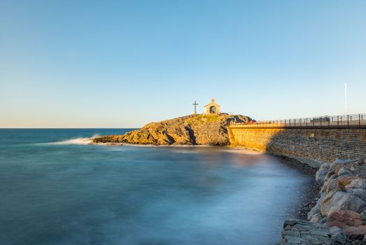 Tourists near chapel of Saint Vincent in sea of Collioure in south of France.