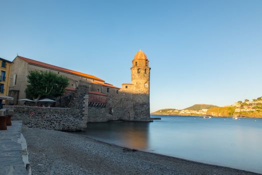 Coliure, France :  2020 june 22 : Beautiful autumn day in the tourist city of Colliure in Occitania whit on back the church of Notre dames des Anges, France.