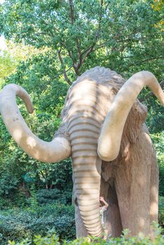 Barcelona, Spain  :  june 26, 2020: These are unidentified visitors near a monument to Mammoth in the Ciutadella Park.