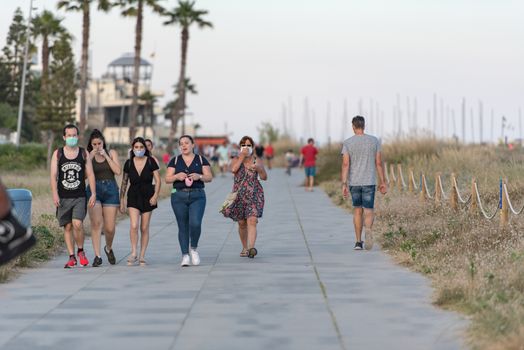 Castelldefels, Spain: 2020 June 25: People walk in the coastline of Castelldefels in Barcelona in summer after COVID 19 on June 2020.