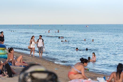 Castelldefels, Spain: 2020 June 25: People in the beach of Castelldefels in Barcelona in summer after COVID 19 on June 2020.