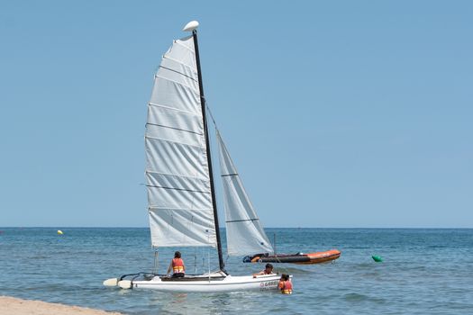 Castelldefels, Spain: 2020 June 25: Boats on the coast of Castelldefels in Barcelona in summer after COVID 19 on June 2020.