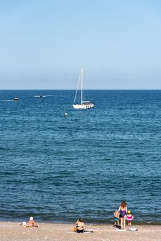 BARCELONA - JUNE 26, 2020: Barceloneta beach with people in summer after COVID 19 on June 26, 2020 in Barcelona, ​​Spain.