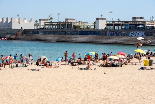 BARCELONA - JUNE 26, 2020: Platja de la Nova Icària beach with people in summer after COVID 19 on June 26, 2020 in Barcelona, ​​Spain.