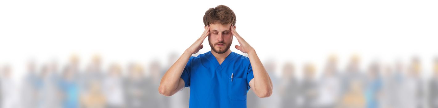 Exhausted male doctor massaging temples while feeling headache and crowd of people on background isolated on white