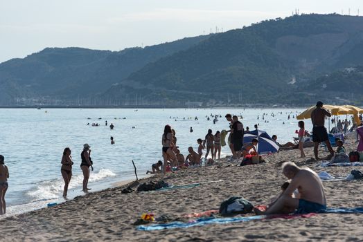 Castelldefels, Spain: 2020 June 25: People in the beach of Castelldefels in Barcelona in summer after COVID 19 on June 2020.