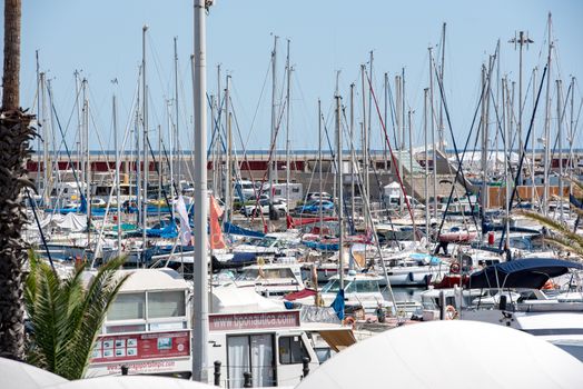 BARCELONA - JUNE 26, 2020: Port Olimpic in summer after COVID 19 on June 26, 2020 in Barcelona, ​​Spain.