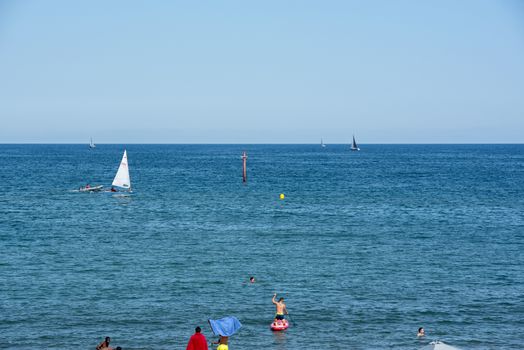 BARCELONA - JUNE 26, 2020: Barceloneta beach with people in summer after COVID 19 on June 26, 2020 in Barcelona, ​​Spain.