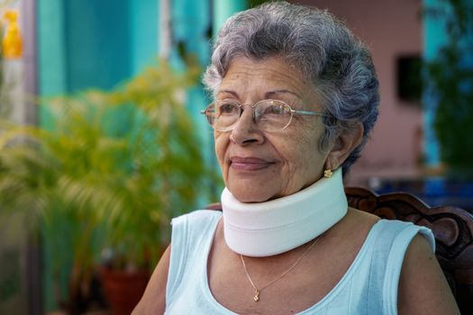 Elderly woman wearing homemade looking cervical immobilizer collar