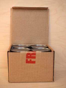 Fragile corrugated cardboard box packet parcel with tin cans