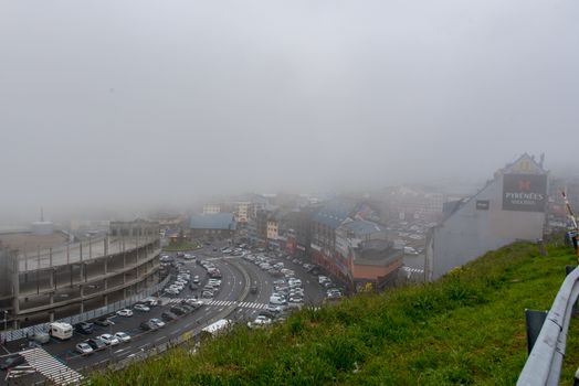 Pas de la Casa, Encamp. Andorra : 2020 17 June : Sunny day with low clouds in the town of Pas de la Casa on the border between Frace and Andorra in June 2020.