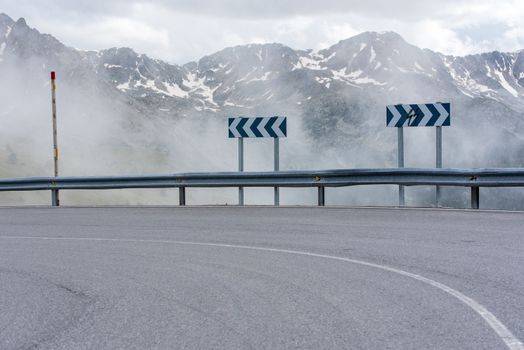 Sunny day with low clouds in the town of Pas de la Casa on the border between France and Andorra in June 2020.