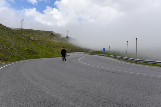 Sunny day with low clouds in the town of Pas de la Casa on the border between France and Andorra in June 2020.