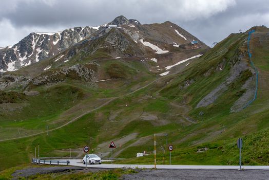 Pas de la Casa, Encamp. Andorra : 2020 17 June : Sunny day with low clouds in the town of Pas de la Casa on the border between Frace and Andorra in June 2020.