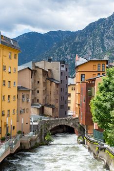 ESCALDES-ENGORDANY, ANDORRA - 2020 juny 8: River Valira on Engordany Bridge and houses view in a snowfall day in small town Escaldes-Engordany in Andorra on juny 2020.