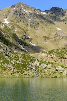 Beautiful view hiking in the Andorra Pyrenees Mountains in Ordino, near the Lakes of Tristaina.